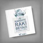 Burkay Adalığ kadehte rakı beyazı kitap, isme imzalı