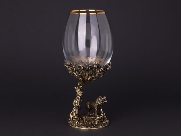 Elegant glass with ornate lion base